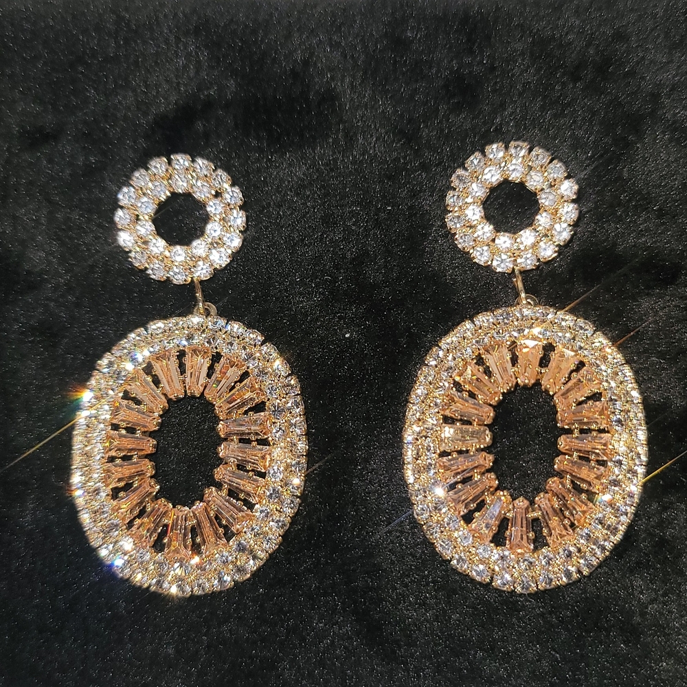 Gold and Silver Starburst Earrings with Intricate Design